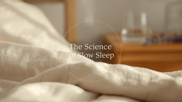 Macro photograph of textured sand-colored linen fabric showing the breathable weave for optimal sleep temperature regulation.