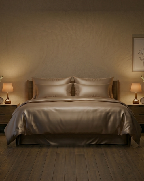 Cozy bedroom with a bed, nightstands, and wall art in warm lighting.