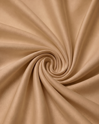 Close-up of golden sand percale fabric with a swirl pattern