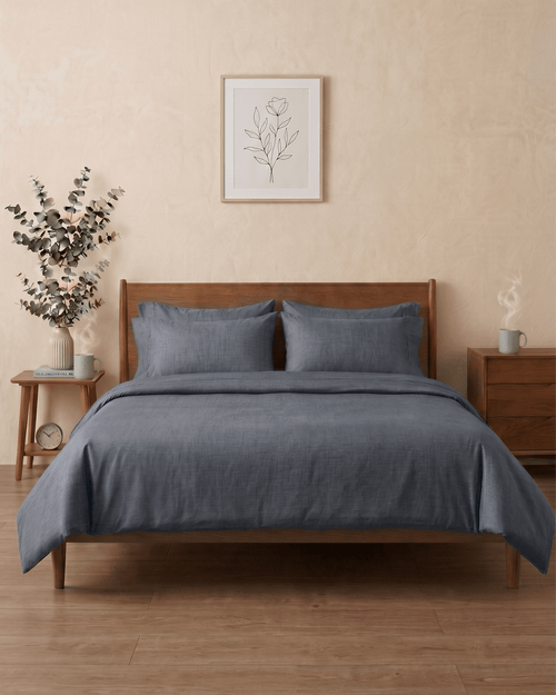 Dark grey percale cotton bedsheet on a bed — The Unhurried Life