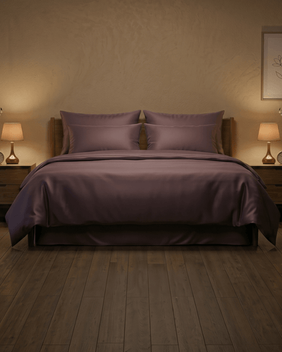 Deep plum sateen cotton bedsheet on a bed — The Unhurried Life