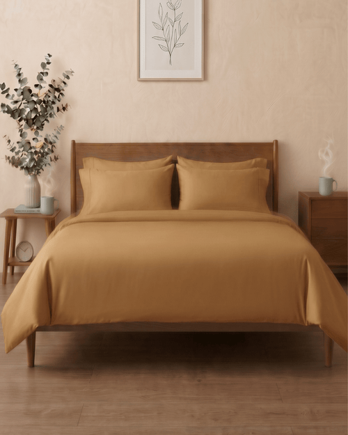 Golden sand percale cotton bedsheet on a bed — The Unhurried Life