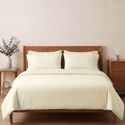 Ivory percale cotton bedsheet on a bed — a soft, creamy off-white, not pure white — The Unhurried Life