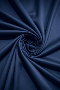 Midnight navy sateen cotton bedsheet folded, showing sheen